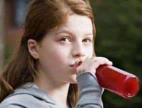 teenage girl drinking a beer