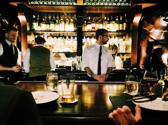 bartenders behind the bar