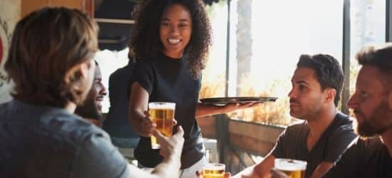 female server who is Georgia alcohol server permit certified offers beer to customer