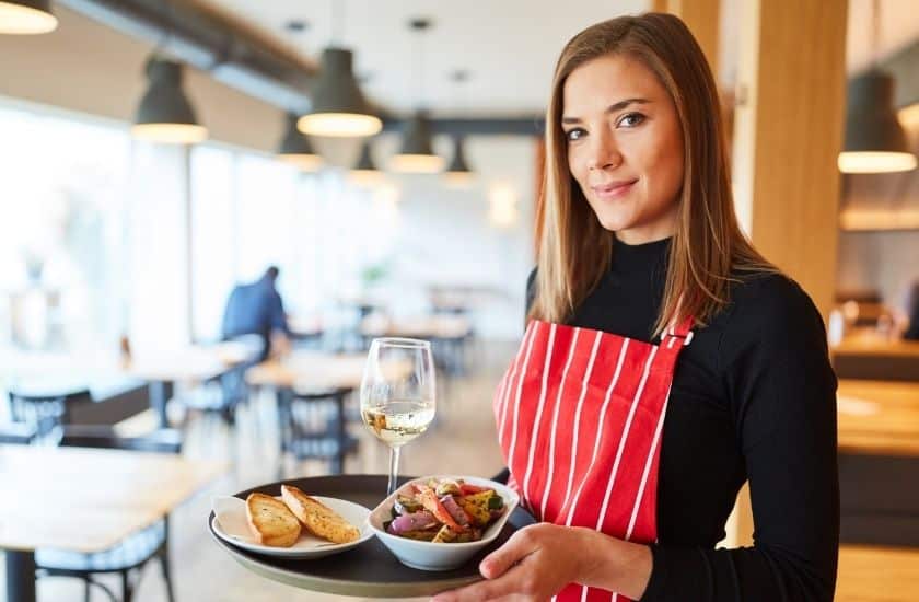 woman server with tray of food