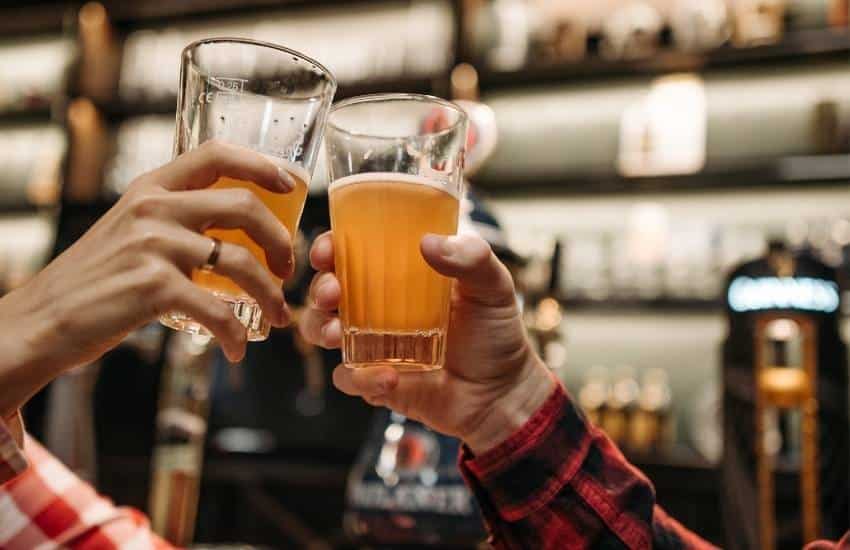 2 beer glasses toasting cheers