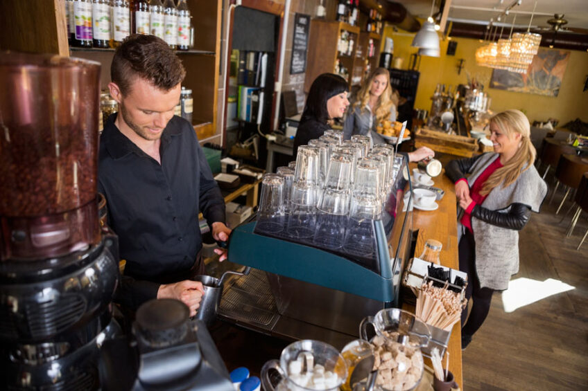 Bartender Working At Counter