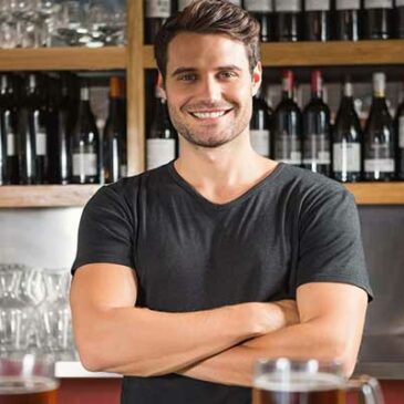 handsome bartender behind the bar, How Much Is a Bartending License?
