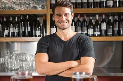 handsome bartender behind the bar