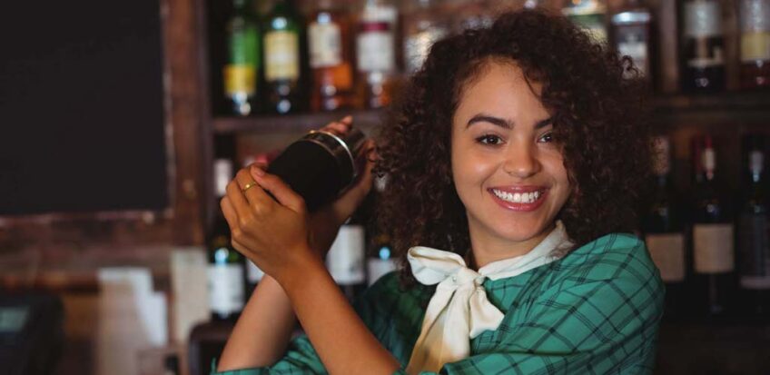 female bartender shaking drink, is bartending a good job