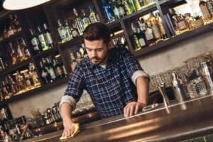 bartender cleaning bar countertop