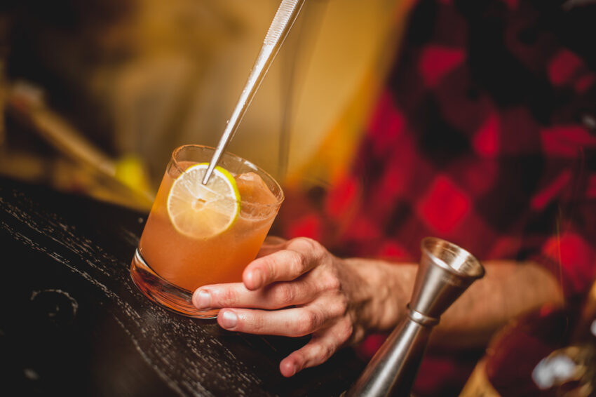 bartender in Texas mixes a drink