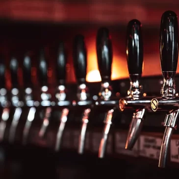 Row of beer taps at a restaurant bar