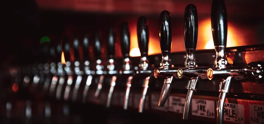 Row of beer taps at a restaurant bar