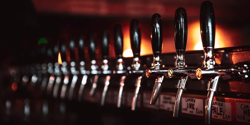 Row of beer taps at a restaurant bar