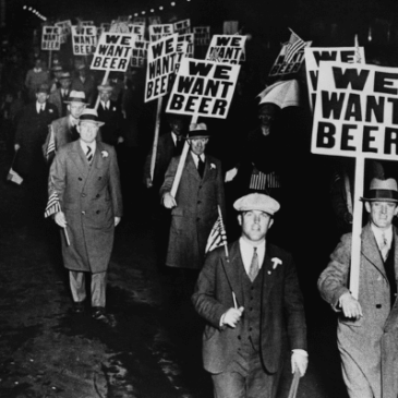 men walking with piquet signs protesting we want beer during prohibition