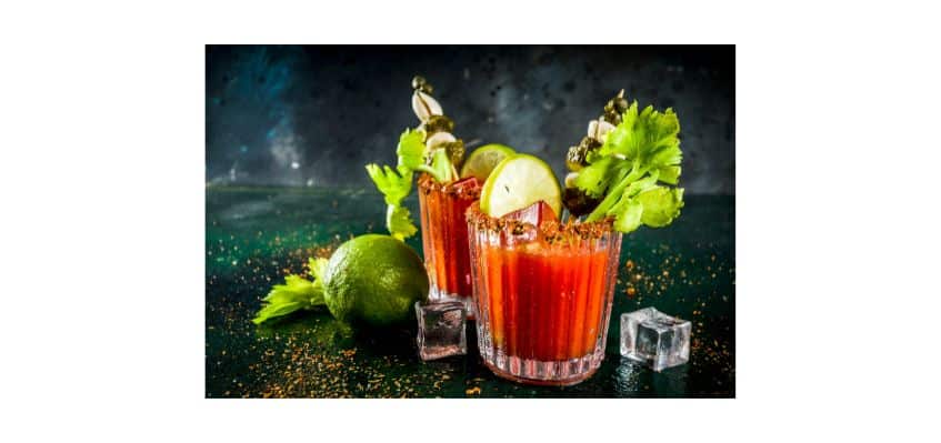 Bloody Mary garnished with celery lime, lemon